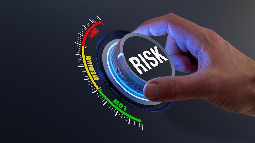 Risk control and mitigation strategy with business manager adjusting knob to lower exposure level for investments, projects, and operations